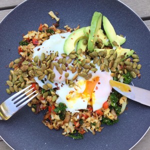 Panfried cauli rice with veggies, poachies, avo and spiced pumpkin seeds